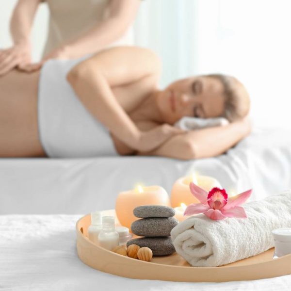 Beautiful spa composition and blurred pregnant woman on background